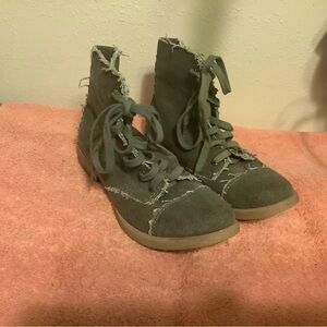Steve Madden green high-top sneakers.